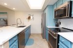 The Kitchen Features Modern Appliances